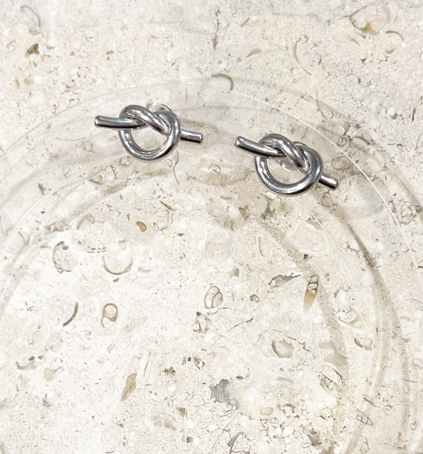 Silver love knot studd earrings image 0